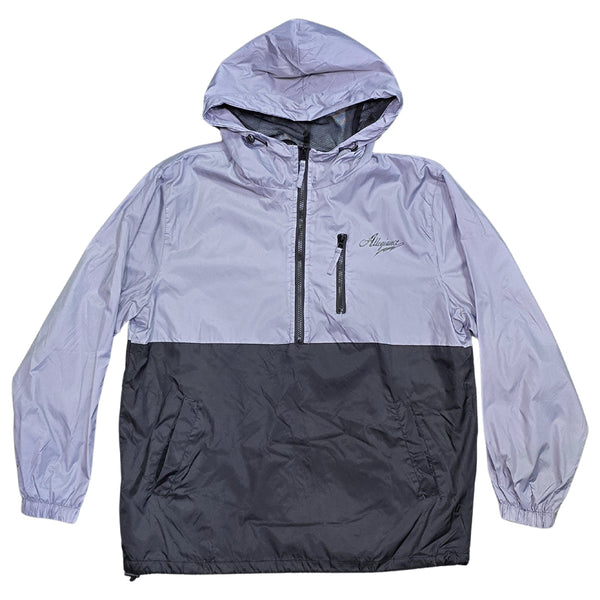 Allegiance Beta Windbreaker in black and silver two-tone color block with half-zip front, chest script logo, and utility pocket.